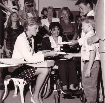Princess Diana talking to young boy