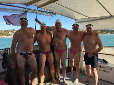 Relay channel swimmers on boat