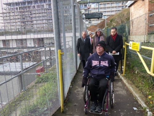 Joe Gilbert in his wheelchair demonstrating the accessible route