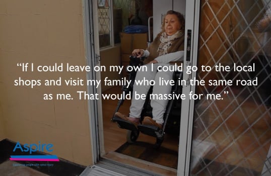 Tracy in her wheelchair in doorway