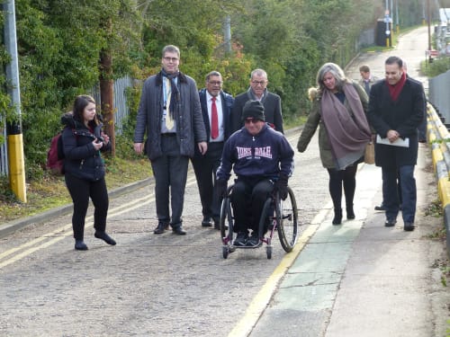 Wheelchair user Joe Gilbert and others at Stanmore station