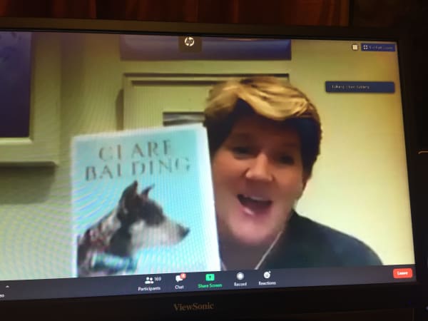 Clare Balding with her book on Zoom