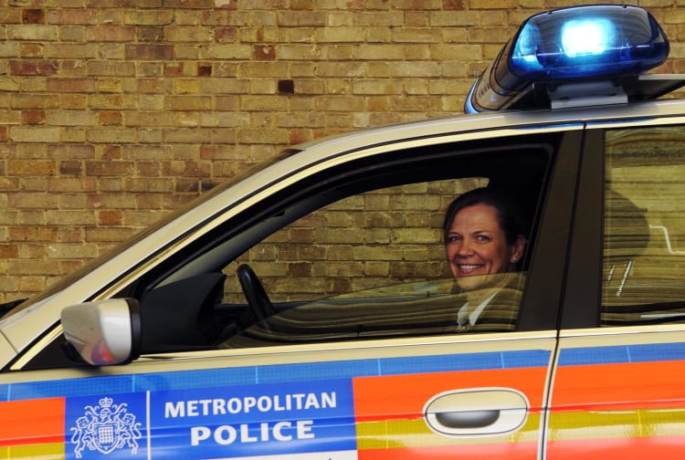 Police woman in a police car