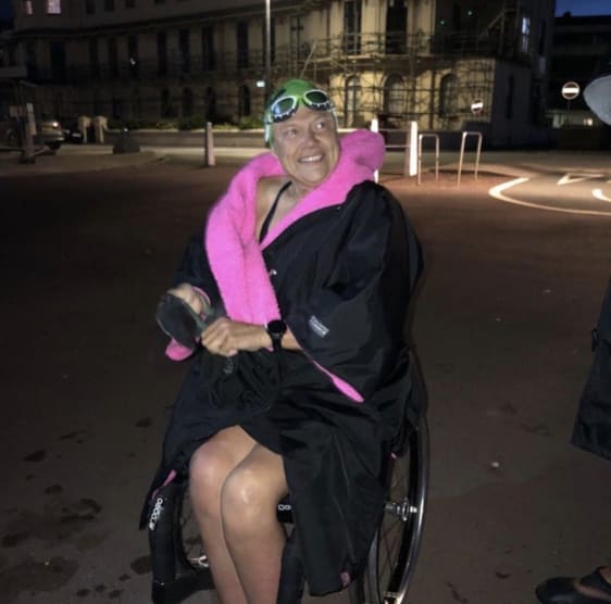 Paula in her wheelchair after swimming at night