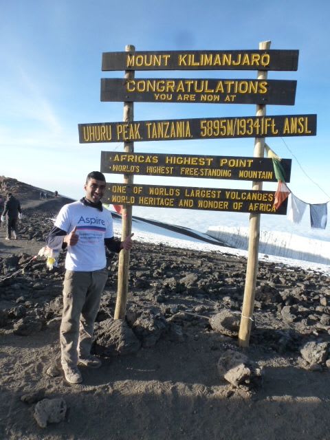 Akshay Pabary at the summit of Mount Kilimanjaro