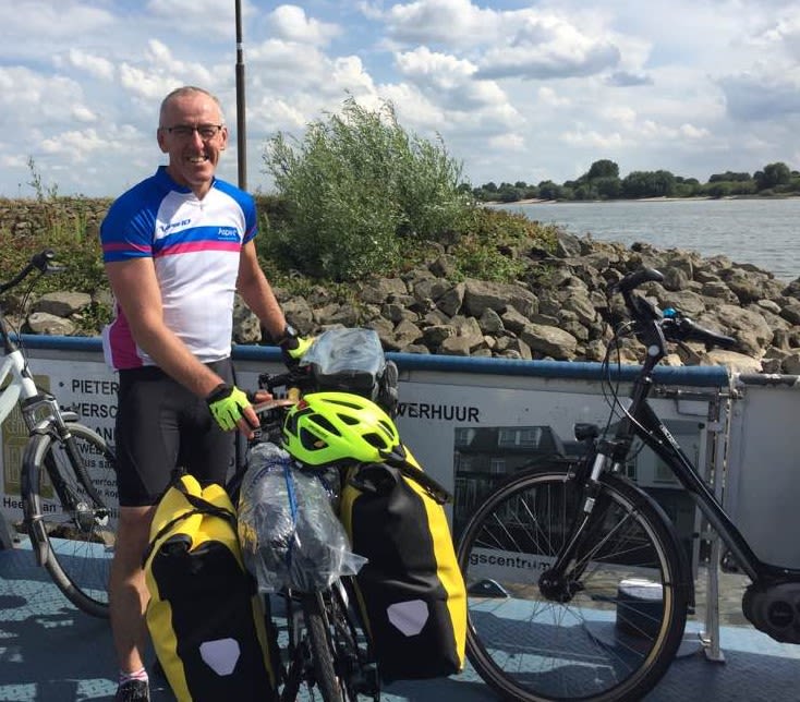 Paul with his bike on a ferry across the Rhine