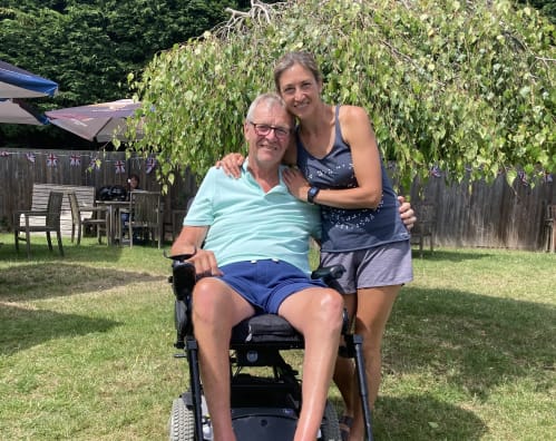 Hannah with her dad in a wheelchair