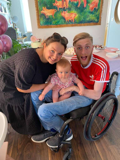 Will in his wheelchair with his wife and daughter