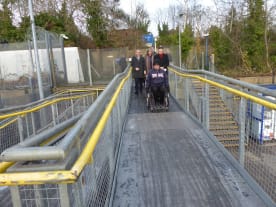 Joe Gilbert in his wheelchair demonstrating the accessible route