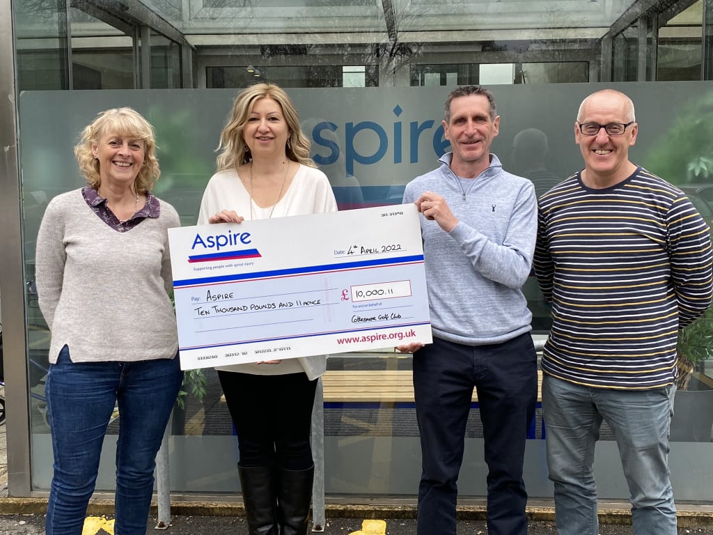 Clive presenting cheque at Aspire