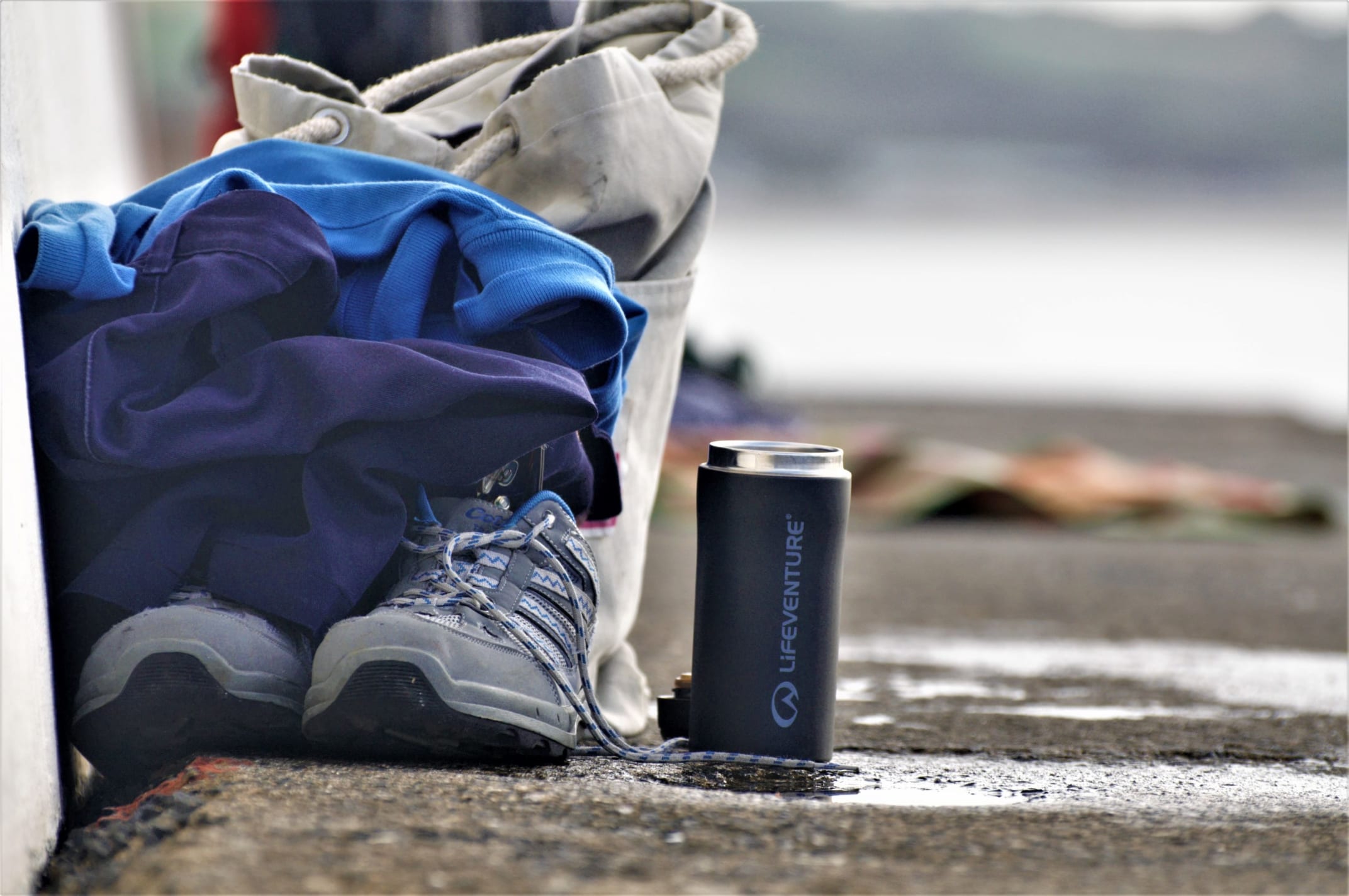 Shoes, clothes and a thermos