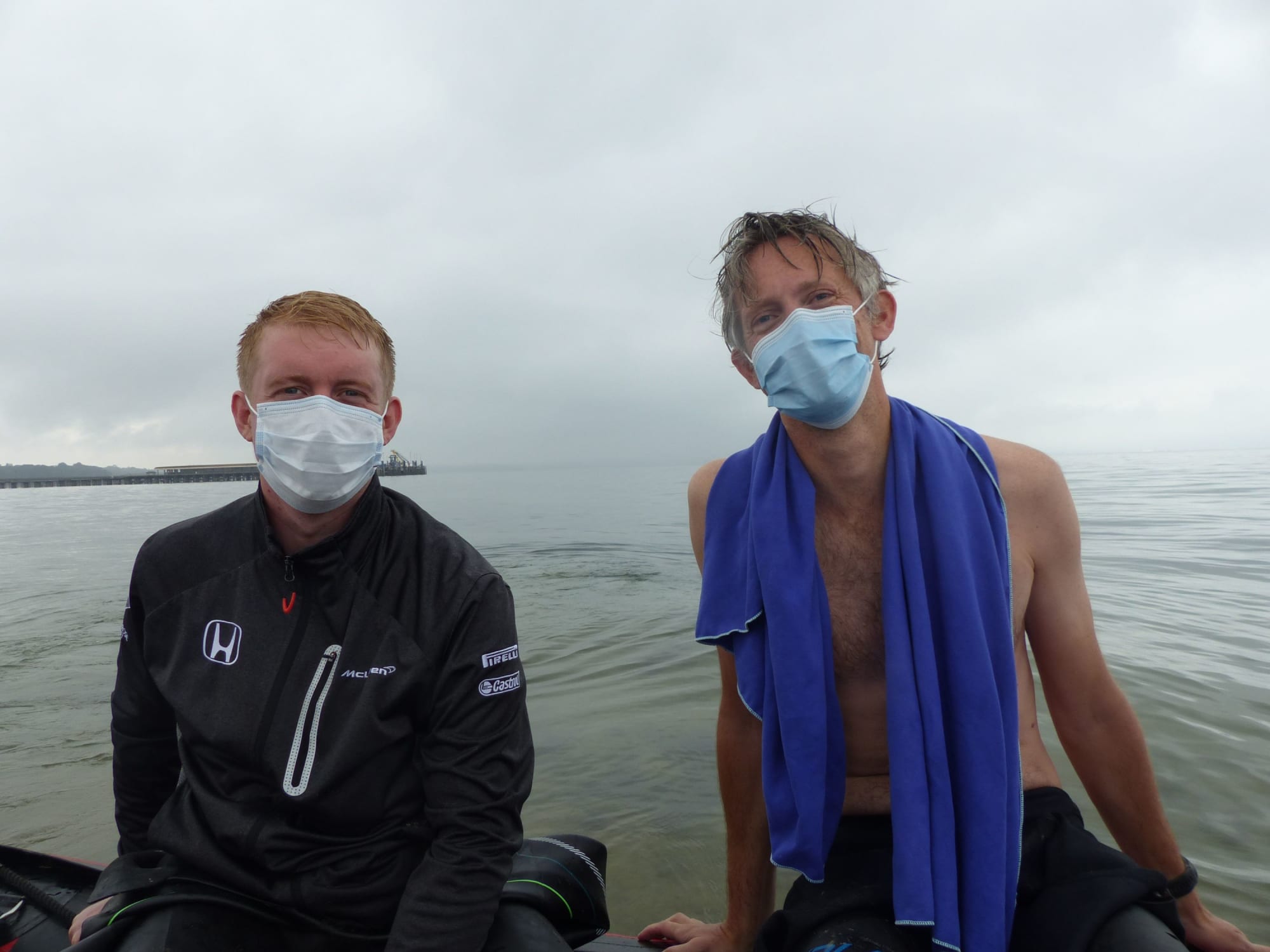 Swimmers in masks on the boat