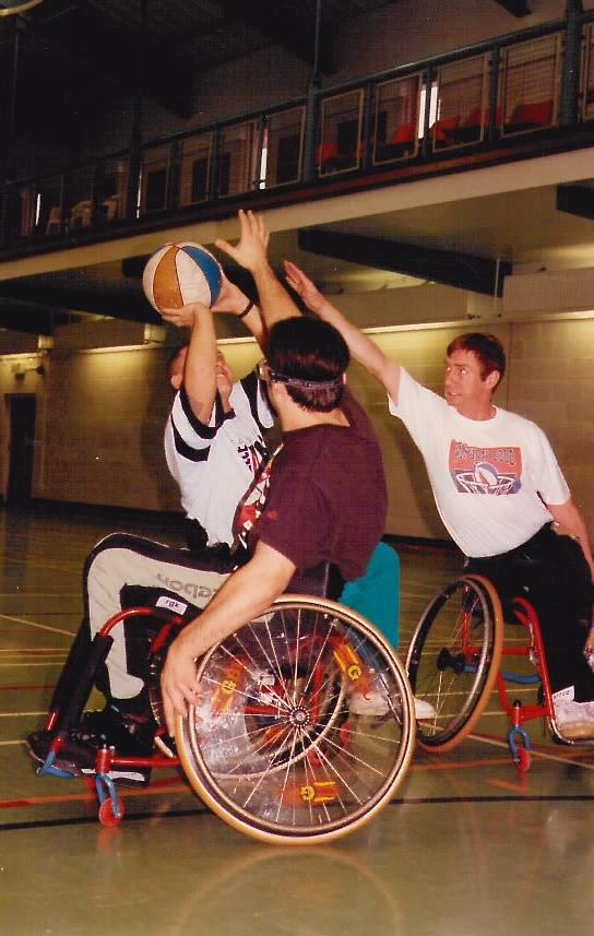 Joe playing wheelchair basketball