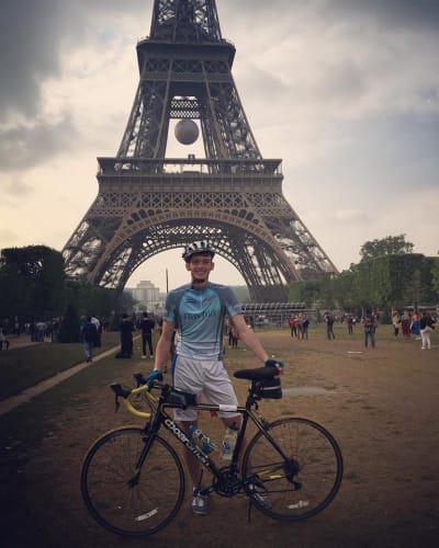 David Round with bike at the Eiffel Tower