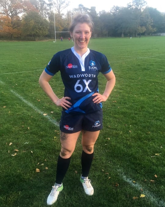 Sarah-Jane on a rugby pitch in her kit