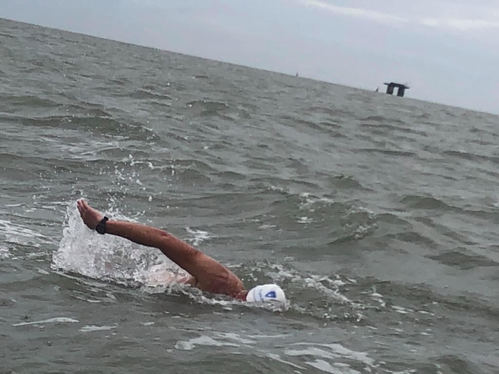 Swimmer with Sealand in the distance