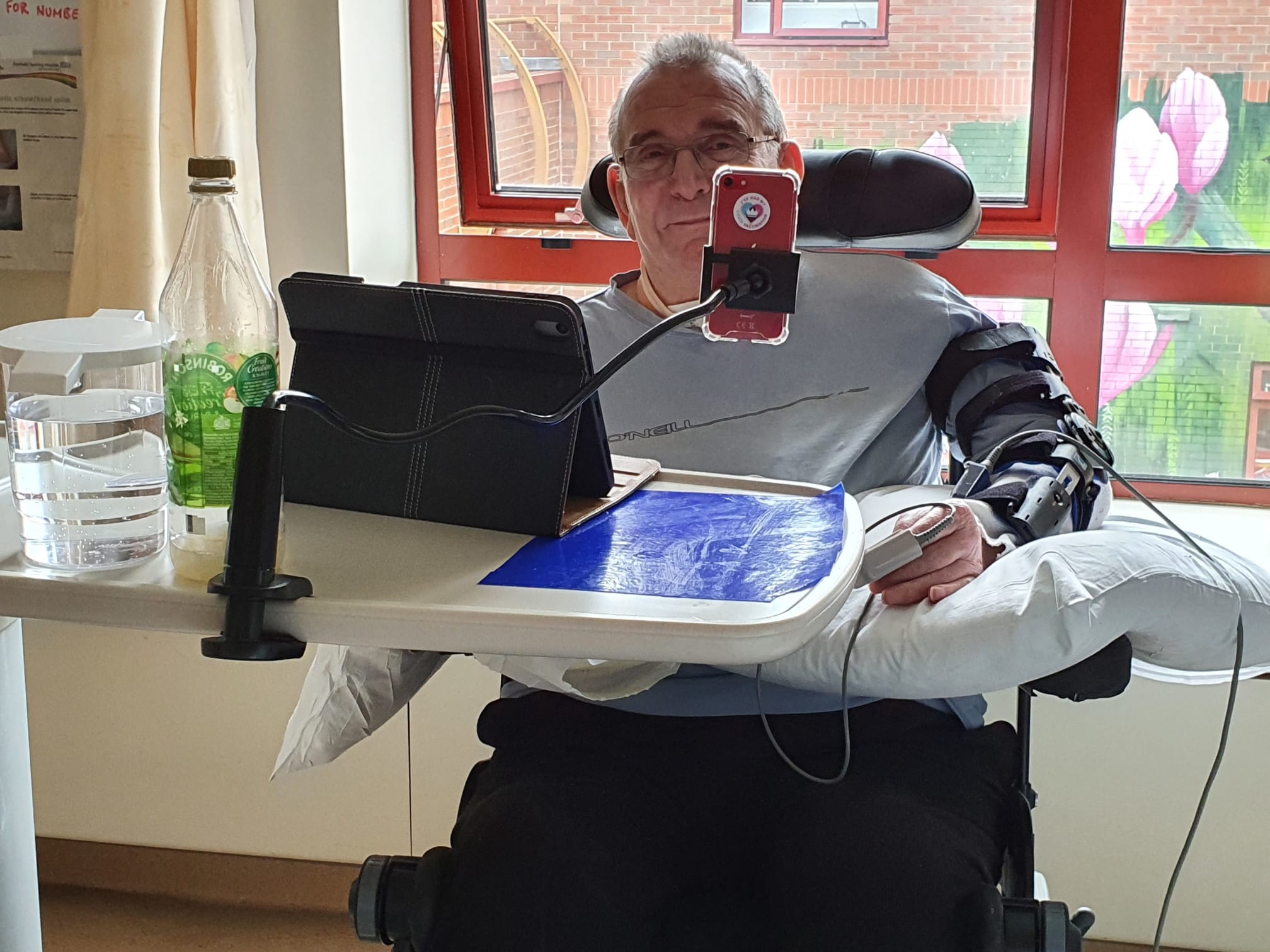 Dennis using assistive technology