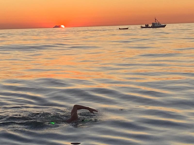 Andrew swimming the Channel at sunrise