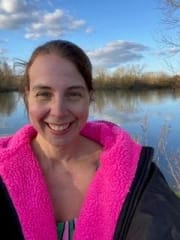 Stella in a robe by a lake