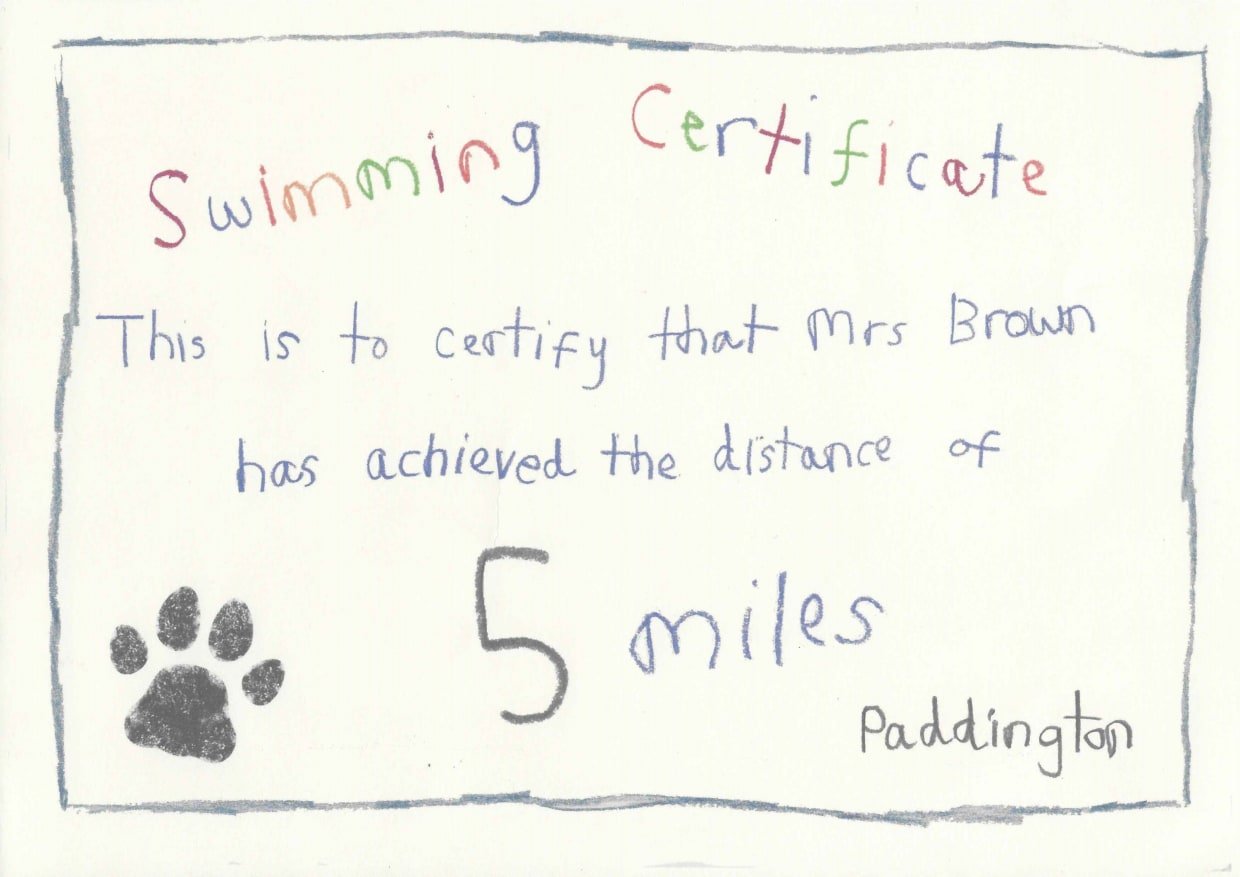 A swimming certificate for Mary Brown signed by Paddington Bear
