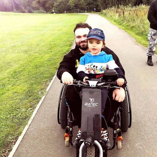 Danny on his bike with his son