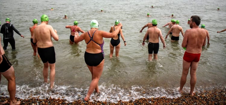 Swimmers at the edge of the water at Dover