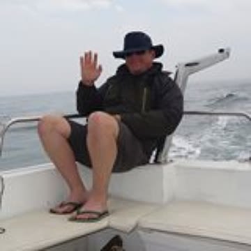 Colin sitting on boat